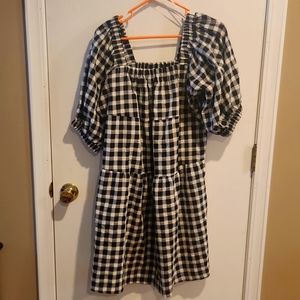 Black and cream checked dress with puffed sleeves